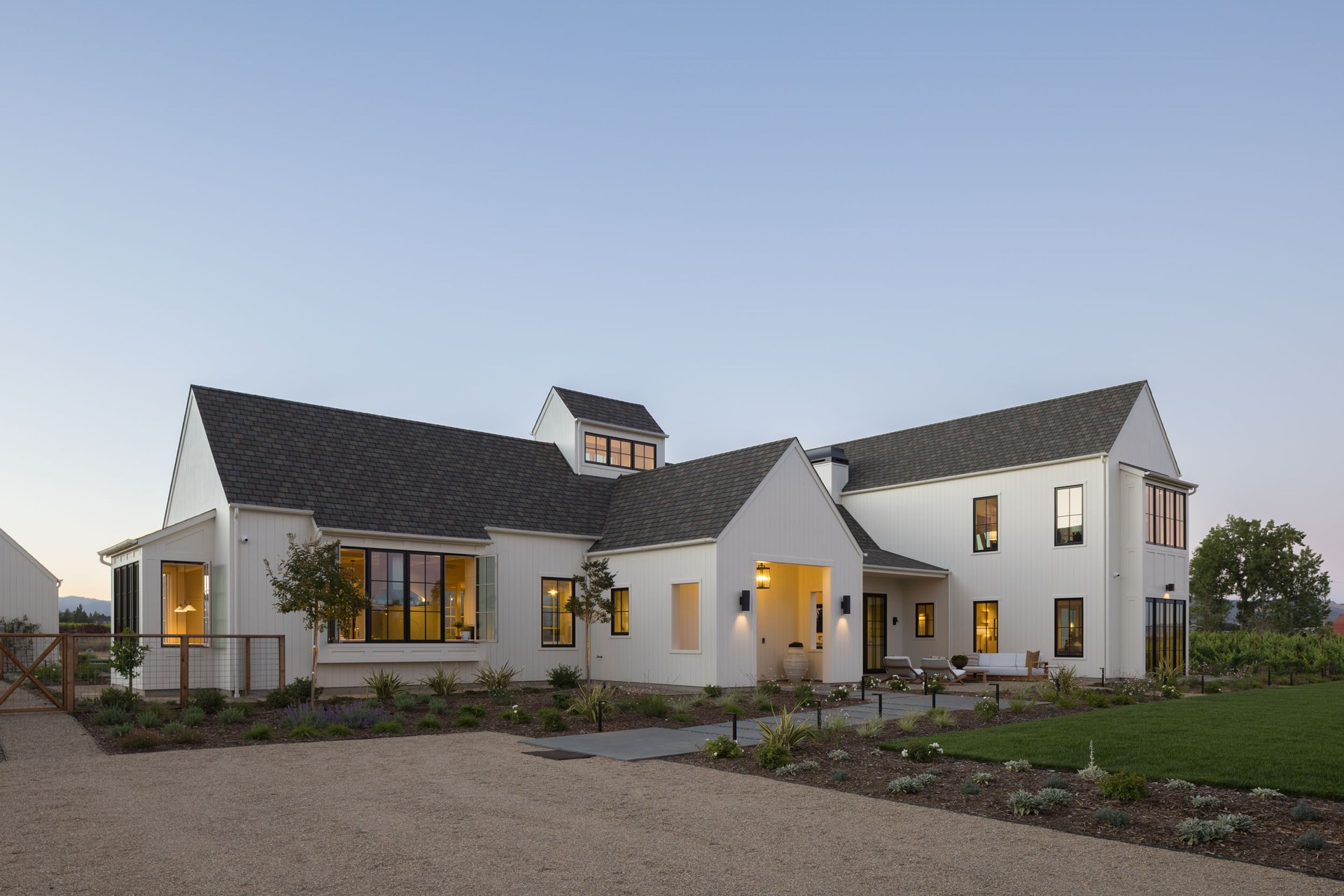 Exterior view of the residence's gabled architecture and covered outdoor living spaces